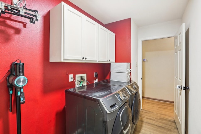 3211 Waterglen Ct, League City, TX 77573 - washroom with cabinet space, light wood finished floors, and separate washer and dryer