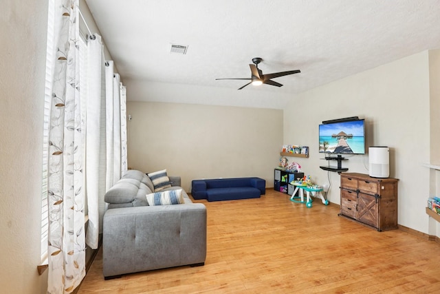 3211 Waterglen Ct, League City, TX 77573 - living area featuring light wood-type flooring, a ceiling fan, and lofted ceiling