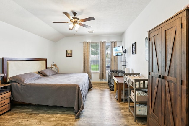 3211 Waterglen Ct, League City, TX 77573 - bedroom featuring wood finished floors, lofted ceiling, and a ceiling fan