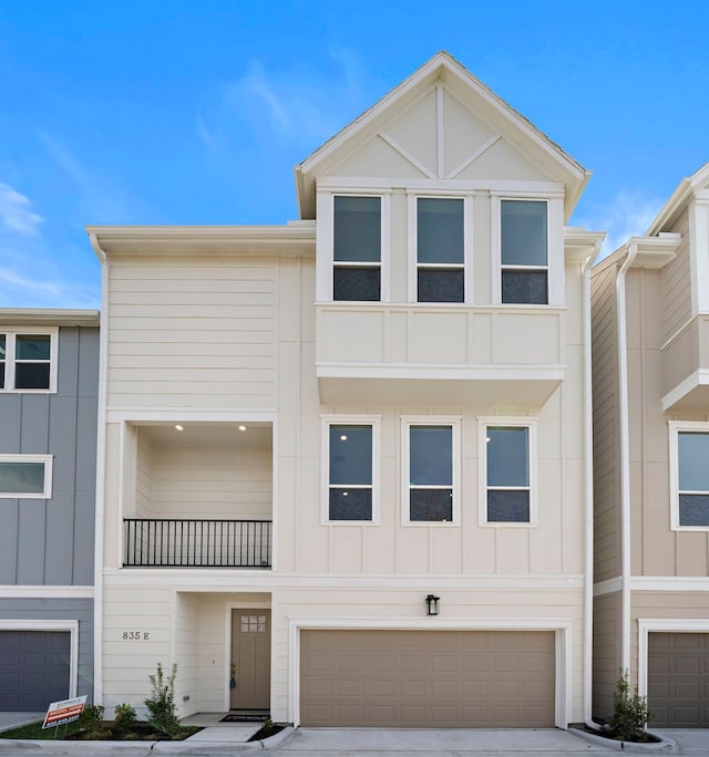 835C Rachel St, Houston, TX 77091 - view of property featuring a garage, driveway, and board and batten siding