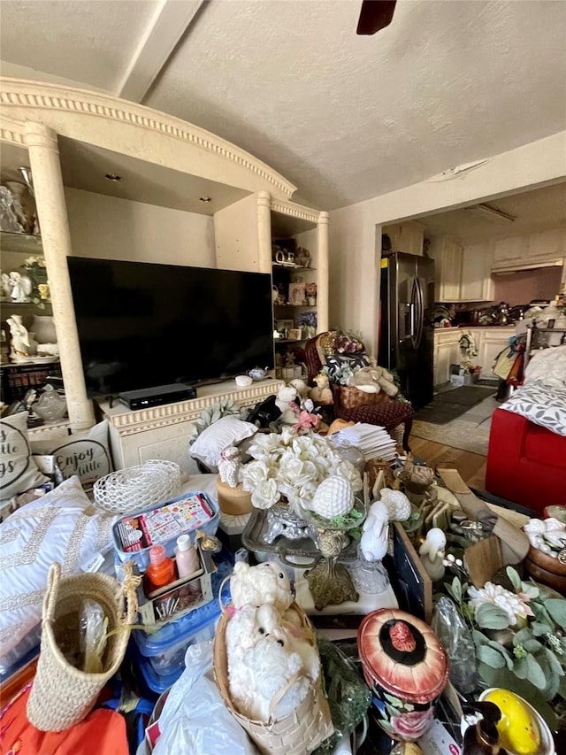 1107 Wooding St, Houston, TX 77011 - living area with wood finished floors and a textured ceiling