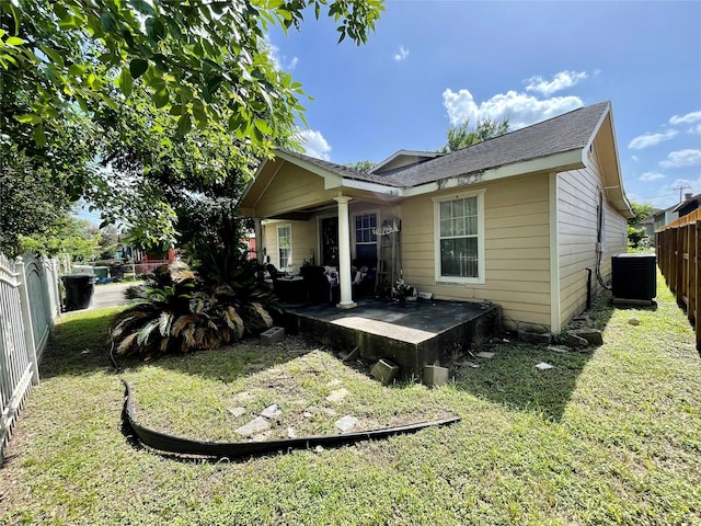 1107 Wooding St, Houston, TX 77011 - rear view of house featuring a fenced backyard and a shingled roof