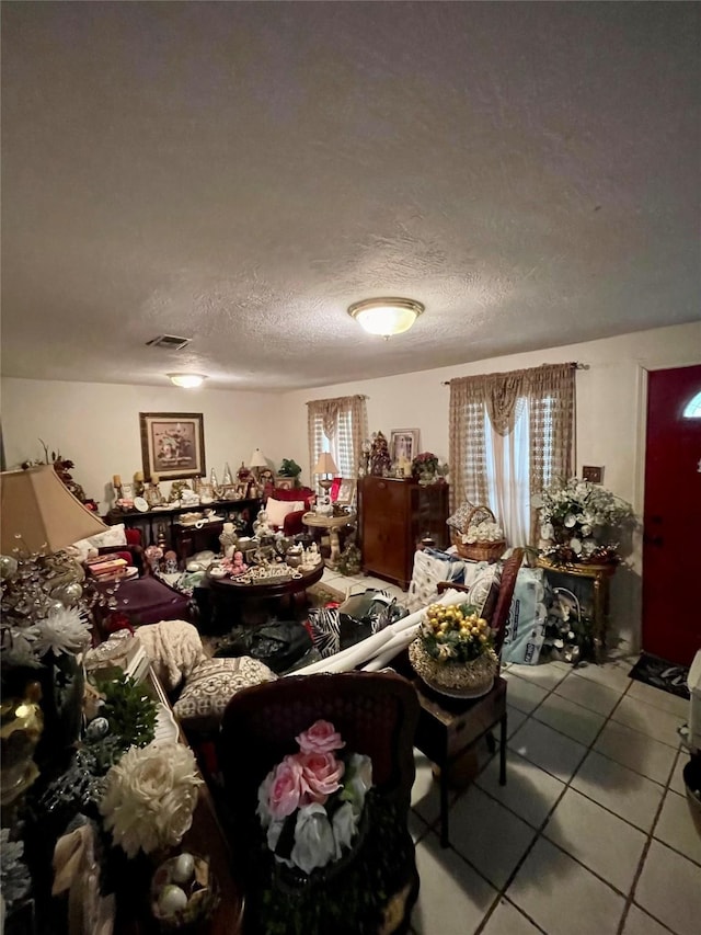 1107 Wooding St, Houston, TX 77011 - living area with tile patterned flooring and a textured ceiling