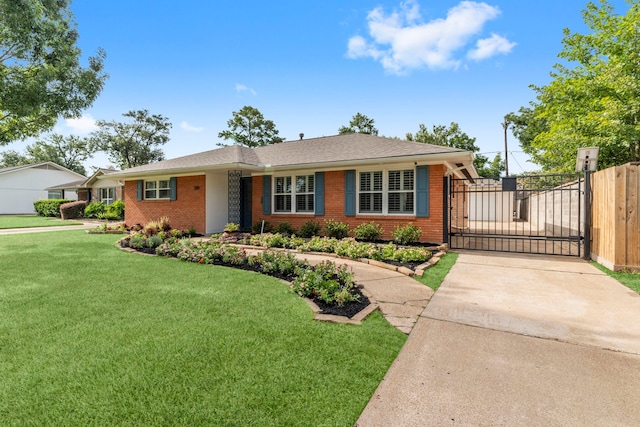 2119 Latexo Dr, Houston, TX 77018 - view of front facade with brick siding, concrete driveway, and a gate