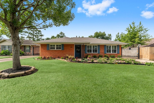 2119 Latexo Dr, Houston, TX 77018 - ranch-style house with a gate, brick siding, and concrete driveway