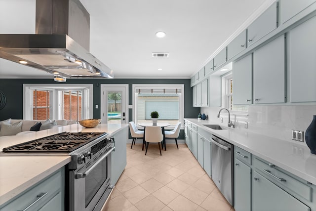 2119 Latexo Dr, Houston, TX 77018 - kitchen with appliances with stainless steel finishes, extractor fan, ornamental molding, light tile patterned floors, and recessed lighting