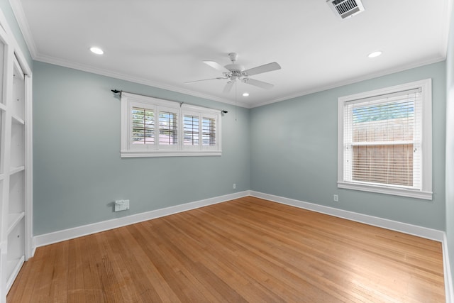 2119 Latexo Dr, Houston, TX 77018 - empty room featuring a ceiling fan, wood finished floors, ornamental molding, and recessed lighting