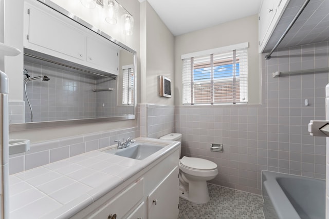 2119 Latexo Dr, Houston, TX 77018 - bathroom featuring vanity, tile walls, and tile patterned floors