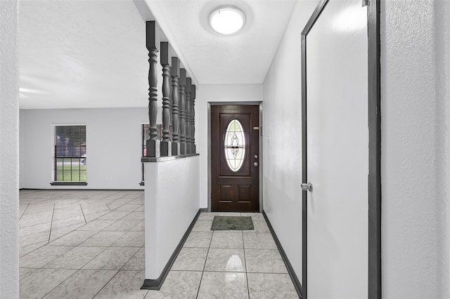 619 Rocky Mountain Dr, Houston, TX 77037 - entryway with baseboards and light tile patterned floors