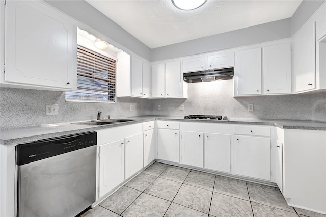 619 Rocky Mountain Dr, Houston, TX 77037 - kitchen with appliances with stainless steel finishes, under cabinet range hood, white cabinets, and decorative backsplash