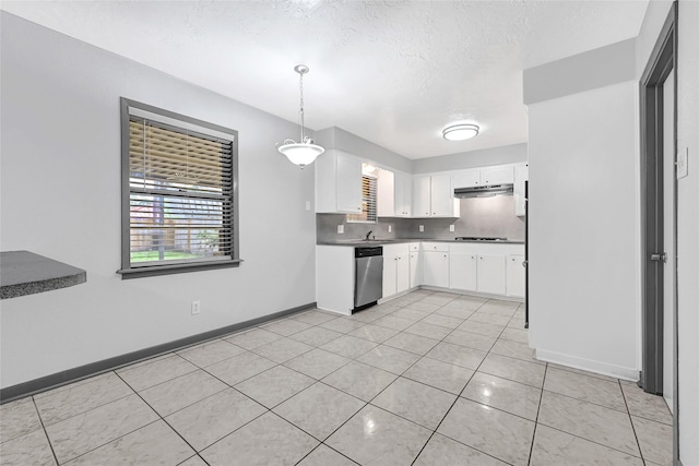 619 Rocky Mountain Dr, Houston, TX 77037 - kitchen featuring stainless steel dishwasher, under cabinet range hood, light tile patterned floors, white cabinets, and cooktop