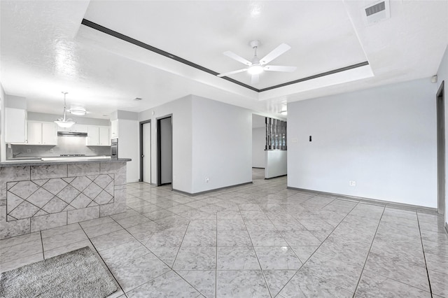 619 Rocky Mountain Dr, Houston, TX 77037 - unfurnished living room with a ceiling fan and a raised ceiling