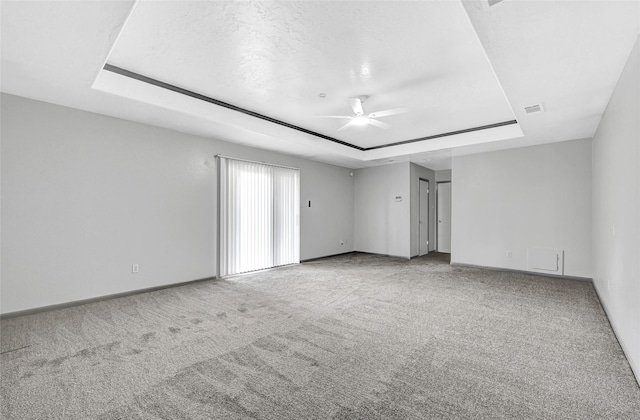 619 Rocky Mountain Dr, Houston, TX 77037 - carpeted empty room with a raised ceiling and a ceiling fan