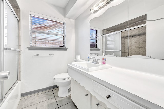 619 Rocky Mountain Dr, Houston, TX 77037 - full bath featuring tile patterned flooring, vanity, and bath / shower combo with glass door