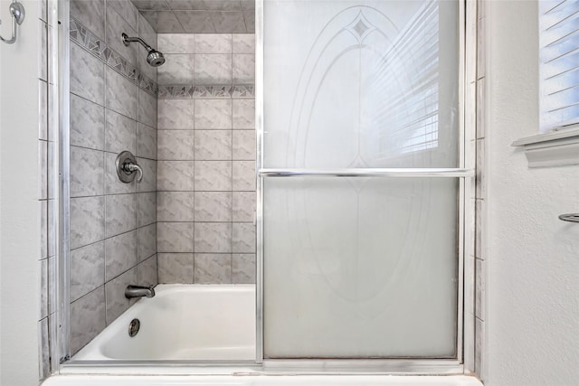 619 Rocky Mountain Dr, Houston, TX 77037 - bathroom featuring shower / bath combination with glass door