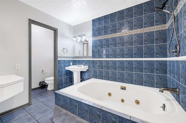 619 Rocky Mountain Dr, Houston, TX 77037 - bathroom featuring a tub with jets and toilet