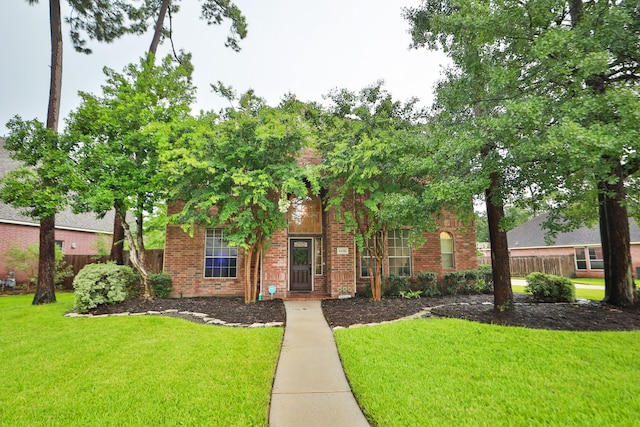 14310 Saint Pierre Ln, Cypress, TX 77429 - view of property hidden behind natural elements featuring brick siding