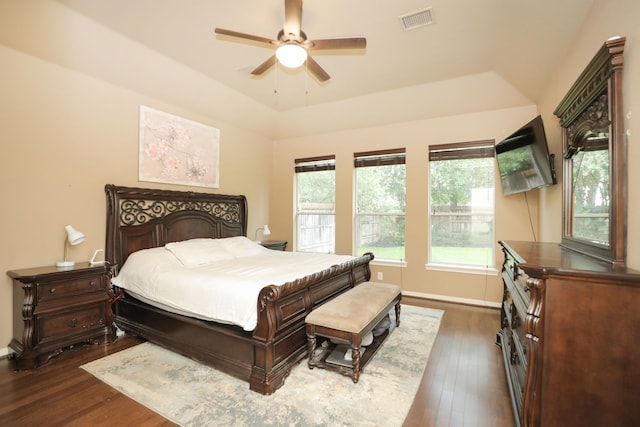14310 Saint Pierre Ln, Cypress, TX 77429 - bedroom with dark wood finished floors, a tray ceiling, and ceiling fan