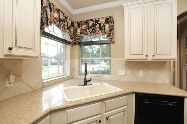 14310 Saint Pierre Ln, Cypress, TX 77429 - kitchen with dishwasher, healthy amount of natural light, tasteful backsplash, light countertops, and crown molding