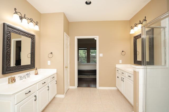 14310 Saint Pierre Ln, Cypress, TX 77429 - bathroom featuring two vanities, tile patterned flooring, and connected bathroom