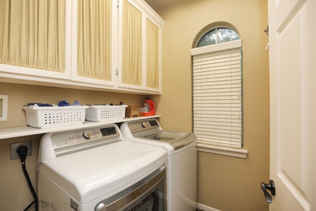 14310 Saint Pierre Ln, Cypress, TX 77429 - laundry area with washer and dryer and cabinet space