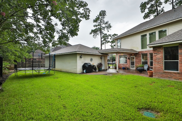 14310 Saint Pierre Ln, Cypress, TX 77429 - view of yard featuring a trampoline and a patio area