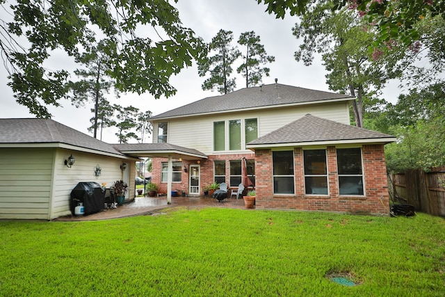 14310 Saint Pierre Ln, Cypress, TX 77429 - rear view of property featuring a patio, brick siding, and a shingled roof