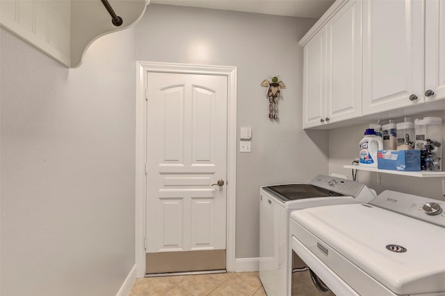 16407 Torry View Ter, Houston, TX 77095 - washroom with washer and clothes dryer, cabinet space, and light tile patterned floors