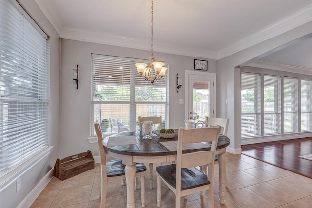 16407 Torry View Ter, Houston, TX 77095 - dining room with light tile patterned floors, a chandelier, and ornamental molding