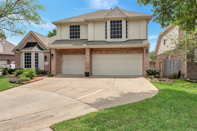 16407 Torry View Ter, Houston, TX 77095 - view of front facade featuring stucco siding, a garage, concrete driveway, brick siding, and roof with shingles