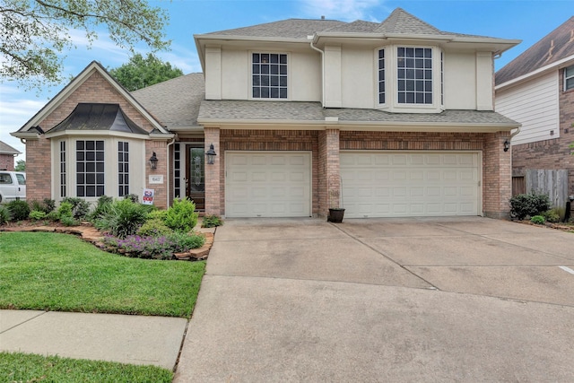 16407 Torry View Ter, Houston, TX 77095 - view of front of house with stucco siding, an attached garage, driveway, and roof with shingles