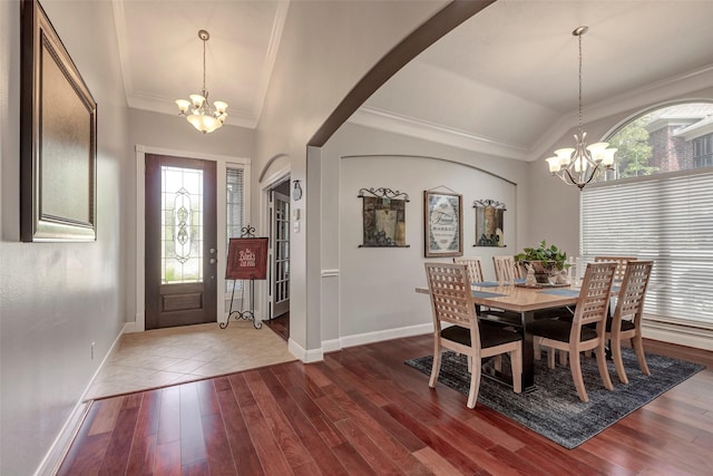 16407 Torry View Ter, Houston, TX 77095 - dining area with a chandelier, lofted ceiling, plenty of natural light, ornamental molding, and dark wood finished floors