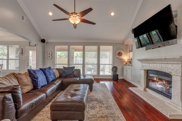 16407 Torry View Ter, Houston, TX 77095 - living area featuring healthy amount of natural light, ceiling fan, high vaulted ceiling, arched walkways, and a high end fireplace