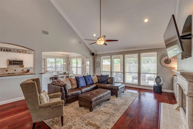 16407 Torry View Ter, Houston, TX 77095 - living area with a ceiling fan, hardwood / wood-style flooring, a fireplace with flush hearth, crown molding, and arched walkways