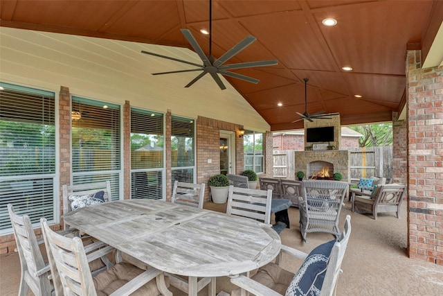 16407 Torry View Ter, Houston, TX 77095 - view of patio with ceiling fan, outdoor dining space, and an outdoor living space with a fireplace