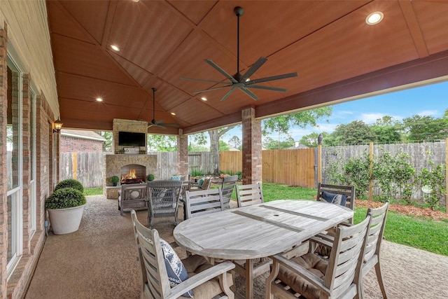 16407 Torry View Ter, Houston, TX 77095 - fenced backyard featuring an outdoor stone fireplace, outdoor dining space, a patio area, and ceiling fan