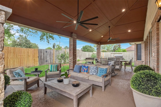 16407 Torry View Ter, Houston, TX 77095 - fenced backyard with outdoor lounge area, outdoor dining area, ceiling fan, and a patio