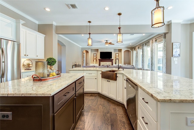 6506 Camillia Ct, Katy, TX 77493 - kitchen featuring a spacious island, arched walkways, dark wood finished floors, stainless steel appliances, and ceiling fan