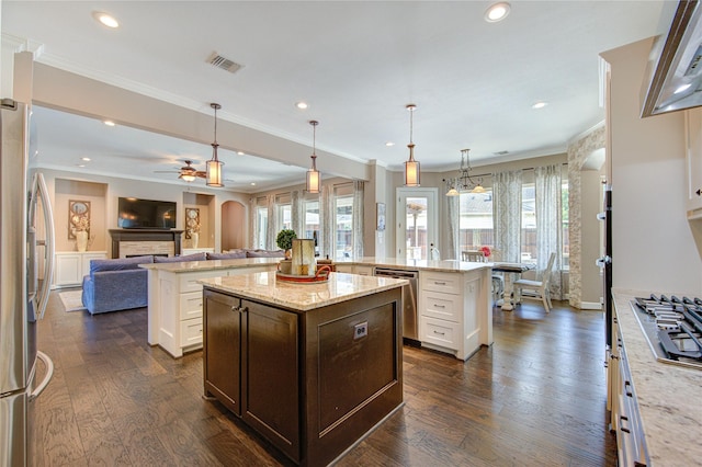 6506 Camillia Ct, Katy, TX 77493 - kitchen featuring a spacious island, appliances with stainless steel finishes, open floor plan, dark wood-type flooring, and recessed lighting
