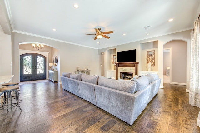 6506 Camillia Ct, Katy, TX 77493 - living room featuring arched walkways, french doors, dark wood-style flooring, ceiling fan, and recessed lighting