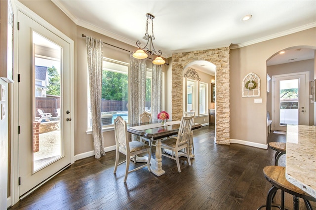 6506 Camillia Ct, Katy, TX 77493 - dining space featuring arched walkways, ornamental molding, and dark wood finished floors