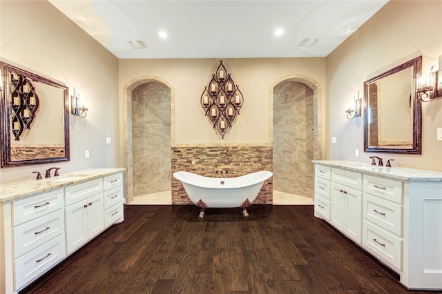 6506 Camillia Ct, Katy, TX 77493 - full bath featuring two vanities, a freestanding bath, wood finished floors, a walk in shower, and tile walls