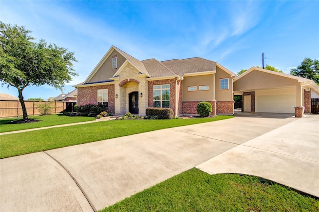 6506 Camillia Ct, Katy, TX 77493 - traditional-style house featuring a garage, driveway, brick siding, stucco siding, and stone siding