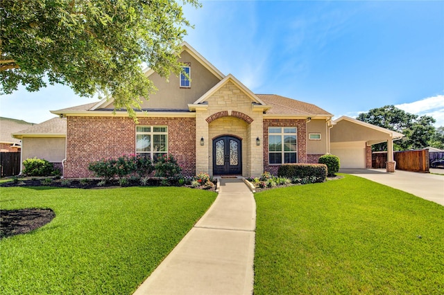 6506 Camillia Ct, Katy, TX 77493 - traditional-style home featuring french doors, stucco siding, driveway, and brick siding