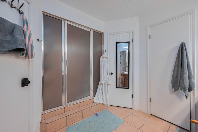 16318 Spinnaker Dr, Crosby, TX 77532 - bathroom featuring a shower stall and tile patterned flooring