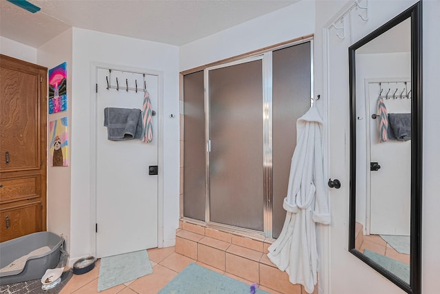 16318 Spinnaker Dr, Crosby, TX 77532 - full bathroom featuring a stall shower and tile patterned flooring