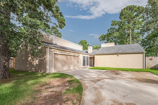 16318 Spinnaker Dr, Crosby, TX 77532 - mid-century modern home with a garage, driveway, and brick siding