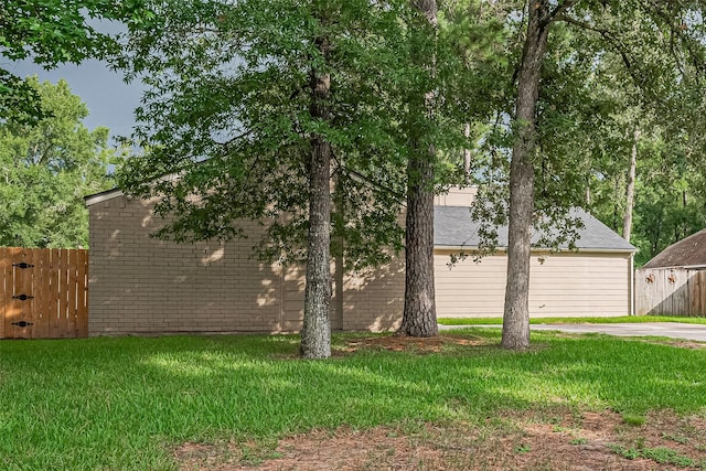 16318 Spinnaker Dr, Crosby, TX 77532 - view of side of property featuring brick siding and a gate