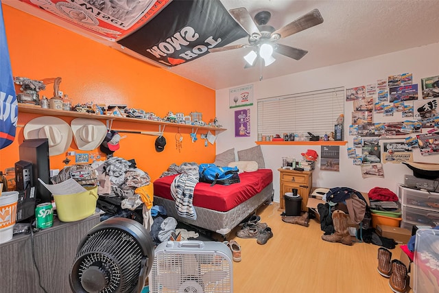 16318 Spinnaker Dr, Crosby, TX 77532 - bedroom with wood finished floors and a ceiling fan