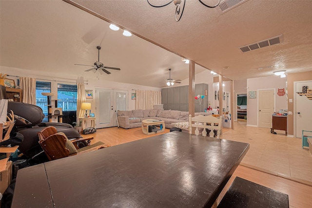 16318 Spinnaker Dr, Crosby, TX 77532 - dining area featuring a ceiling fan, a textured ceiling, and light wood finished floors